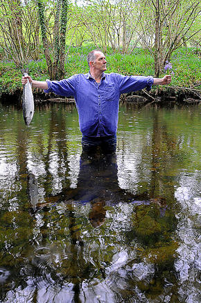 standing-in-the-penkiln-burn-clutching-salmon-and-bluebells-ref-p492